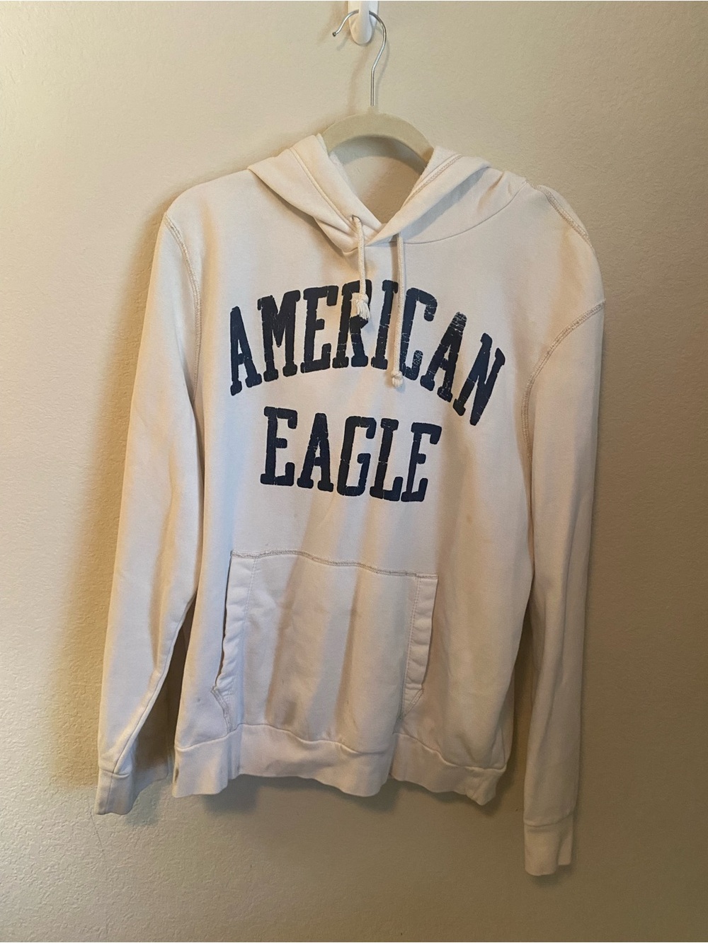 American Eagle Outfitters Cream Pullover Hoodie with Navy Logo